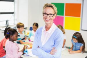 portrait of teacher standing in classroom.jpg
